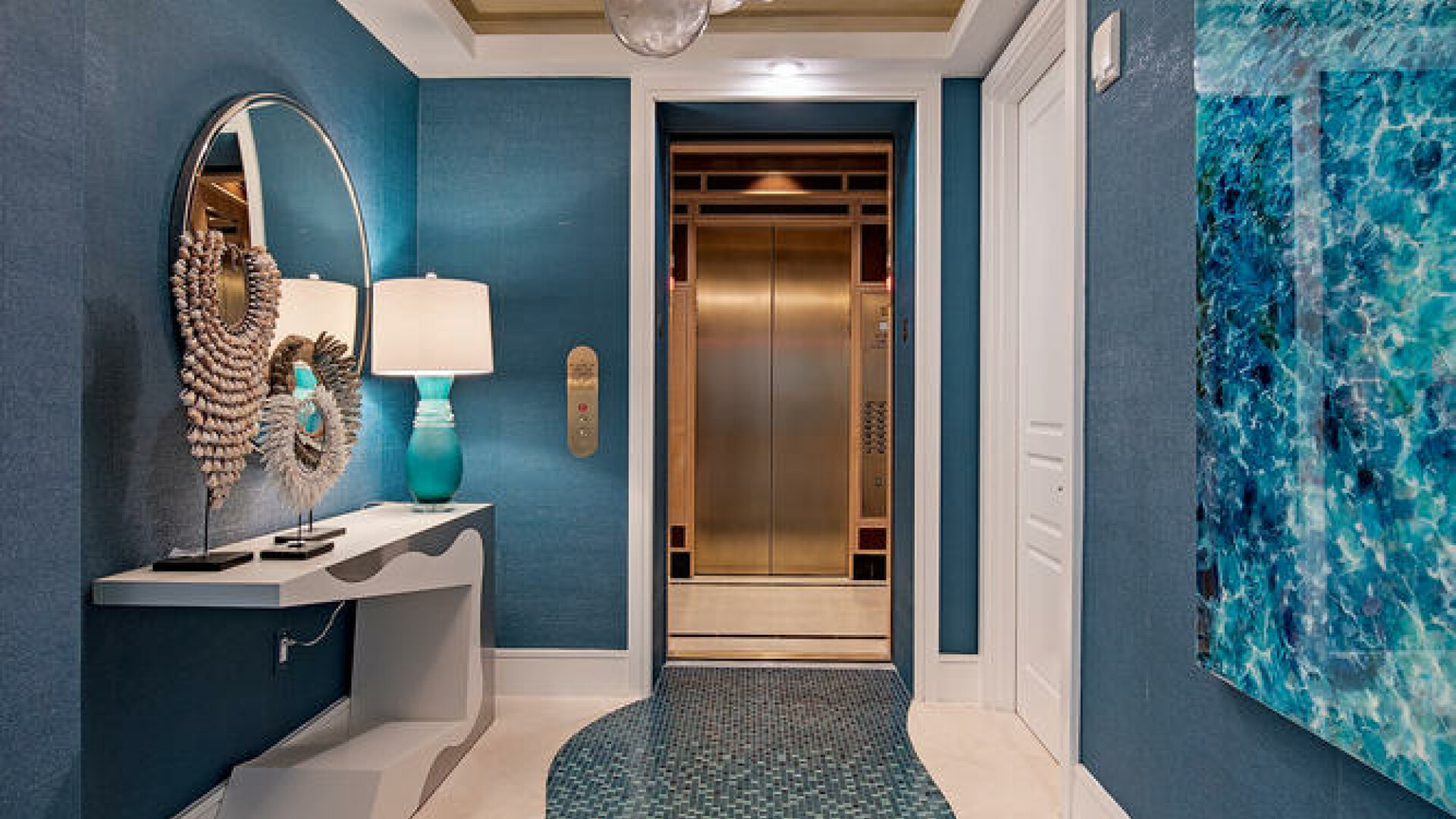 Custom entryway lined with aqua-colored tiles, Naples FL