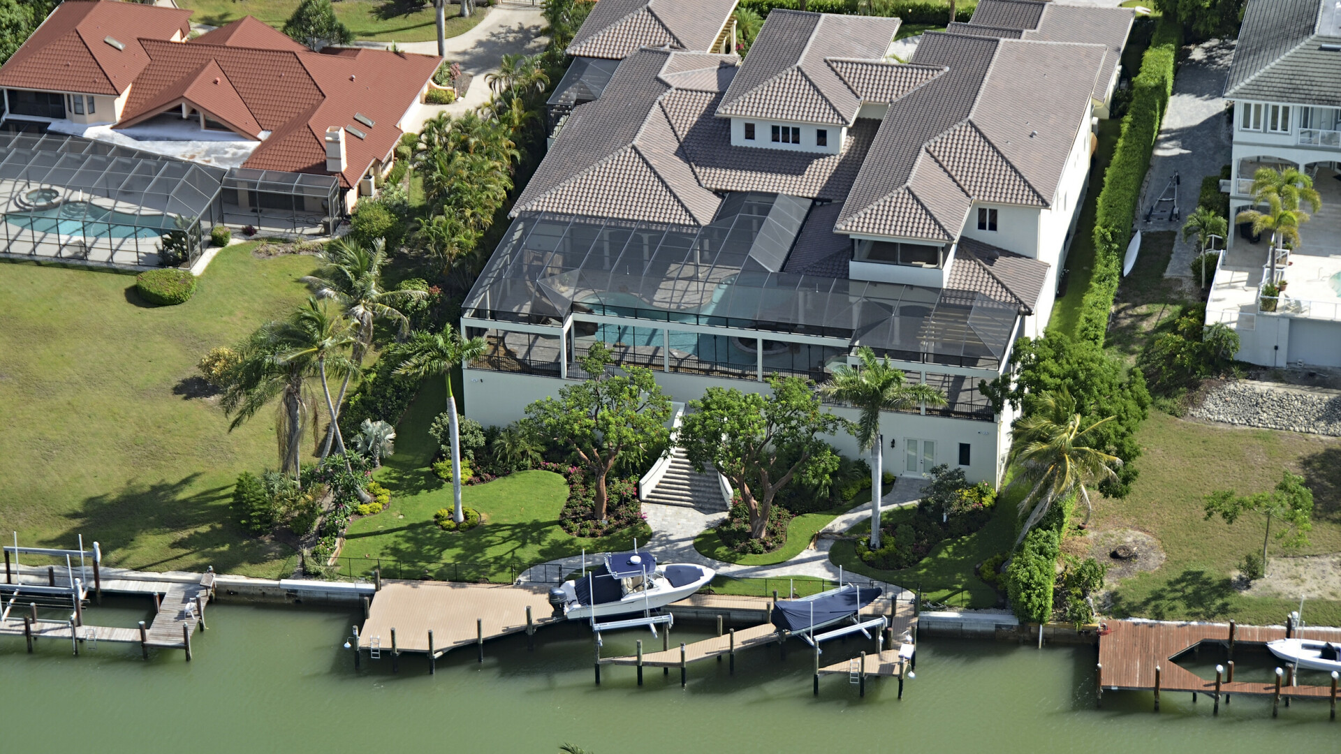 Drone photo of waterfront home with private boat dock, Naples FL
