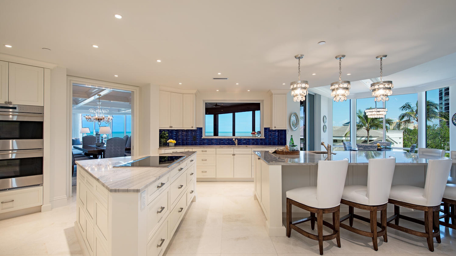 Kitchen remodel with 2 large islands and marble backsplash, Naples FL
